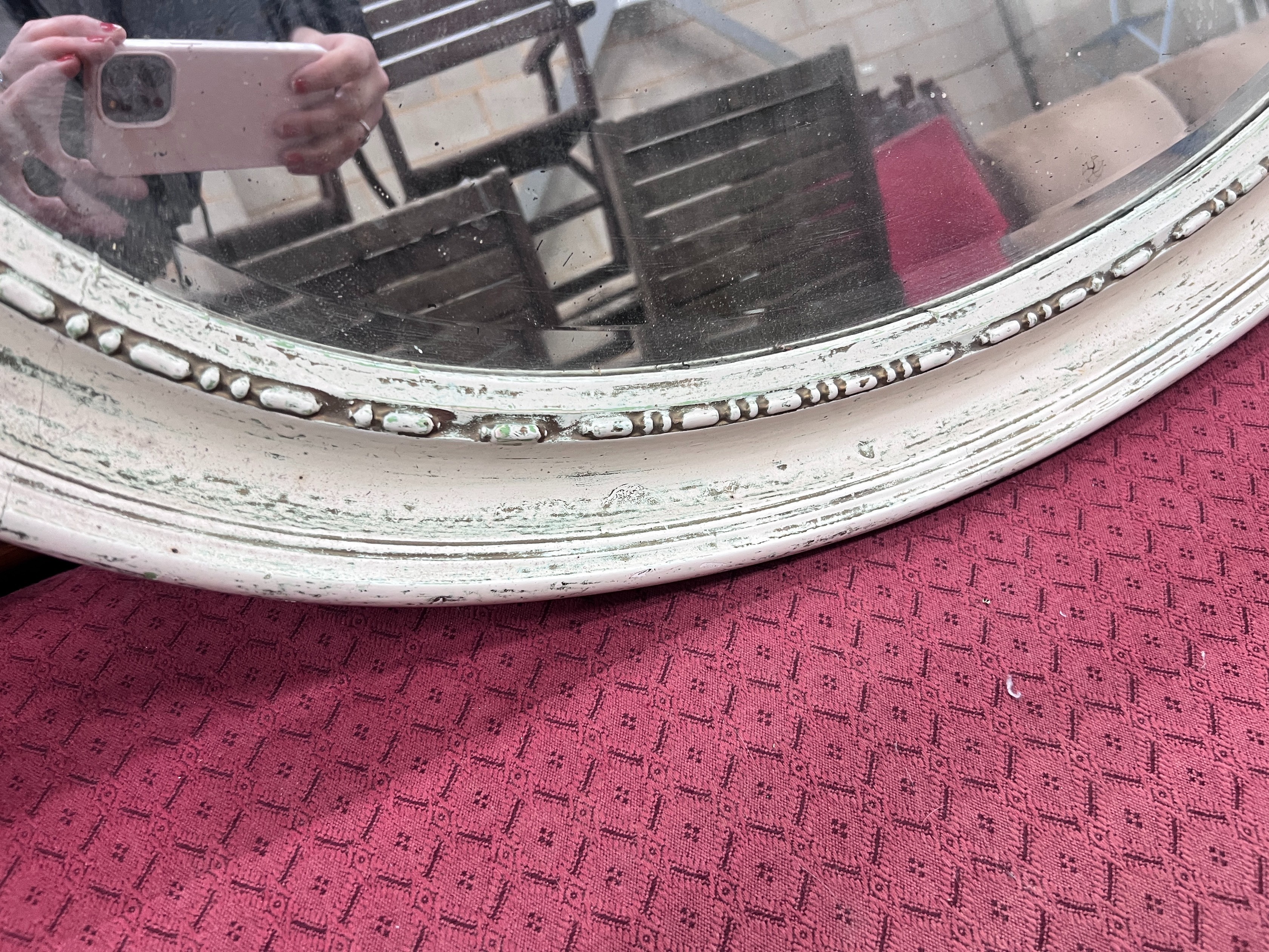 A 1920's white gesso framed oval wall mirror, 84cm *Please note the sale commences at 9am.
